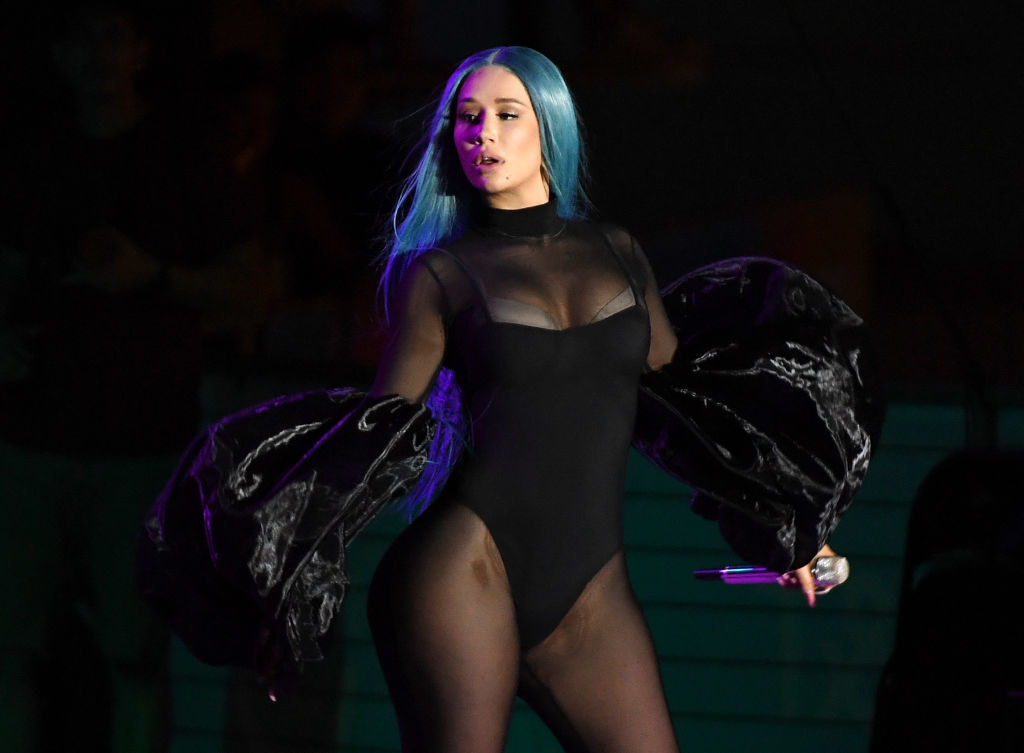 Iggy in an all-black outfit on stage