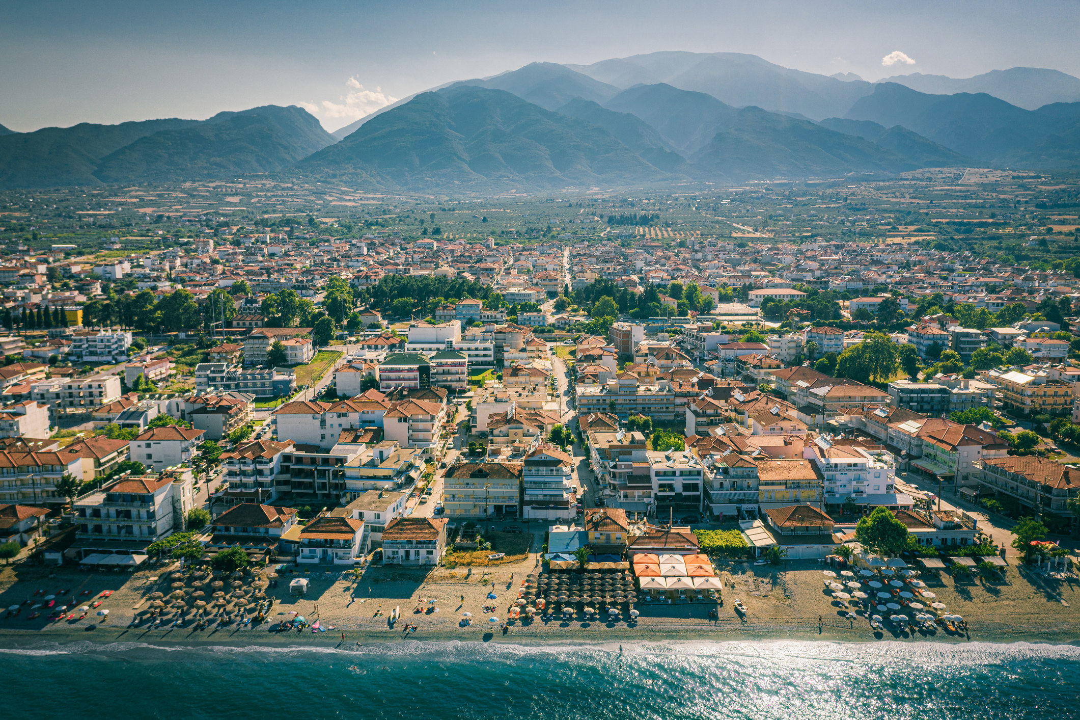 A view of a town before Mount Olympus.