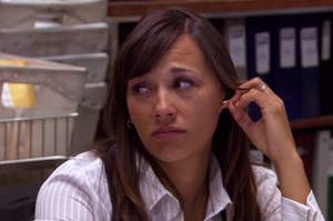 karen from the office has brows raised as if annoyed