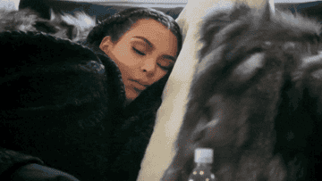 Kim Kardashian sleeping with a fur blanket