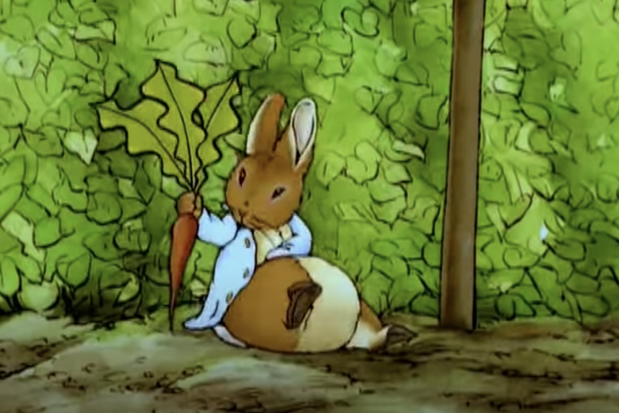 Peter Rabbit pulling a carrot from the ground