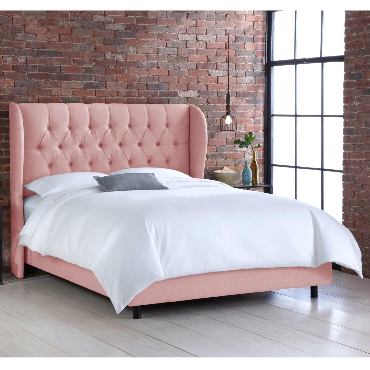 the tufted wingback bed frame in pink
