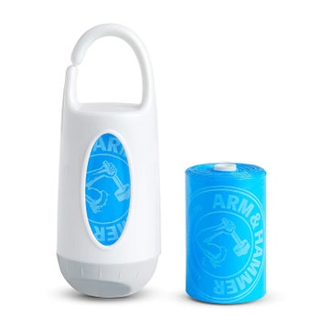 The disposable bag dispenser and a roll of bags in blue