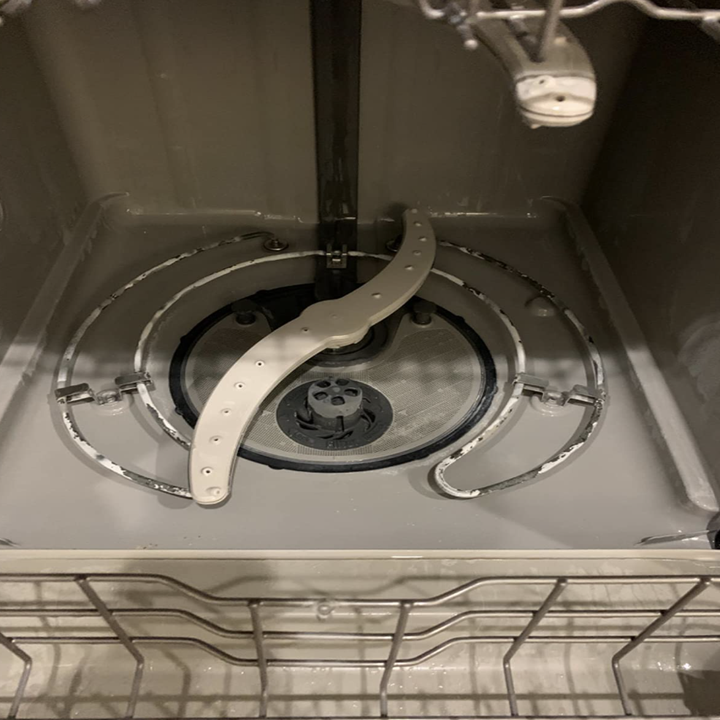 The same reviewer's dishwasher now looking shiny and clean after using the cleaning tablet
