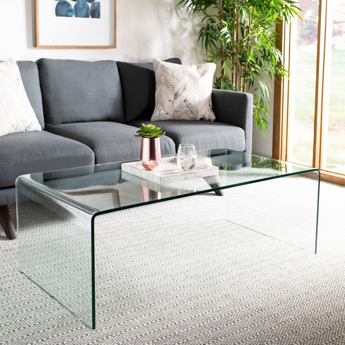 Glass coffee table in a modern living room.