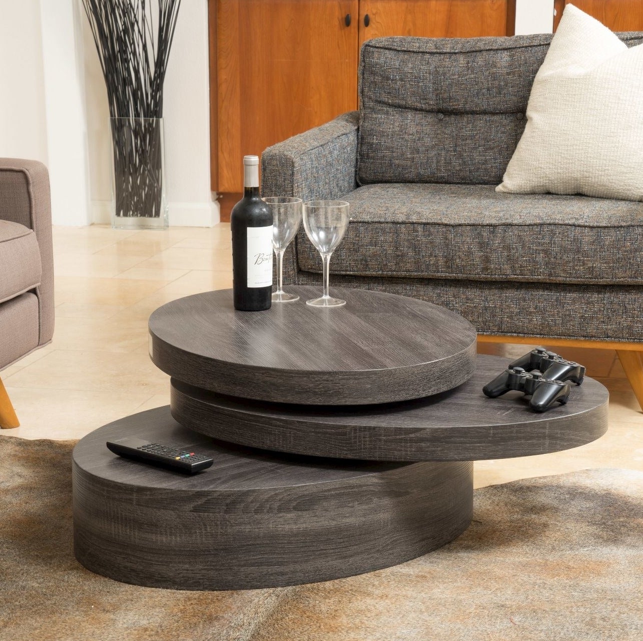 the brown wooden rotatable table with three layers