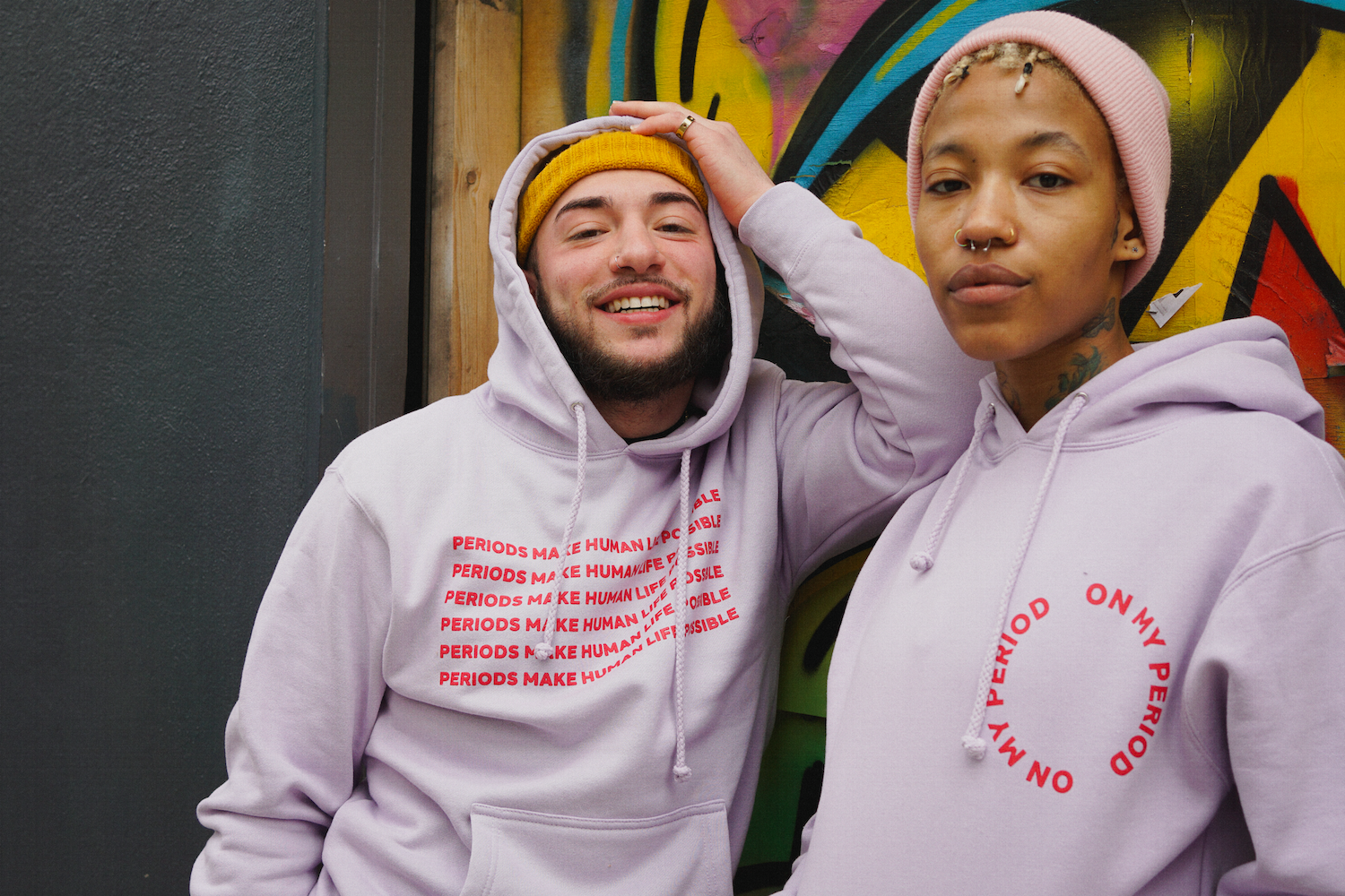 Two models wear hoodies, one says, &quot;on my period,&quot; and the other says, &quot;periods make human life possible&quot;