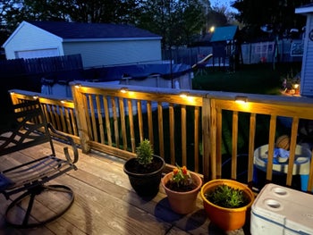 the lights attached to the underside of deck railing
