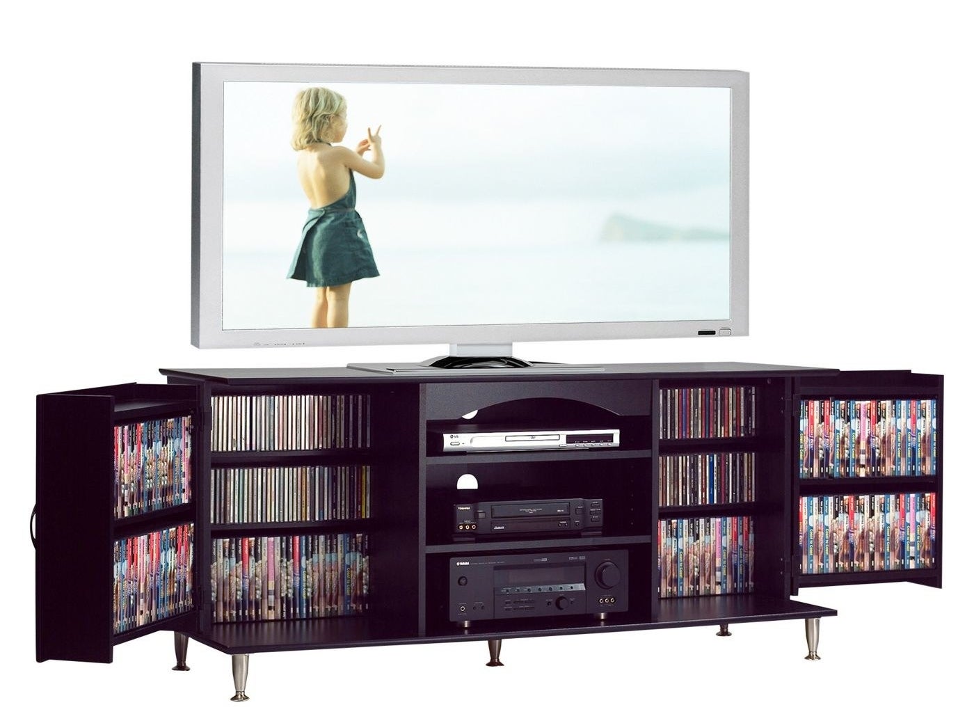 The TV stand filled with media and a TV on top.