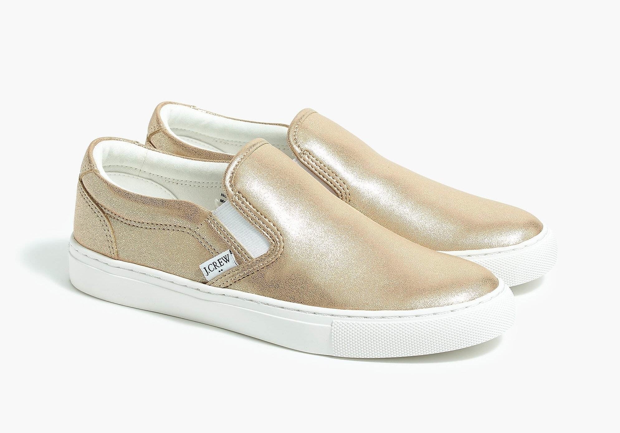 The metallic gold slip-on canvas sneakers
