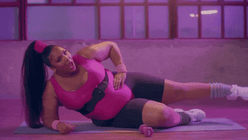 Lizzo working out in the juice music video