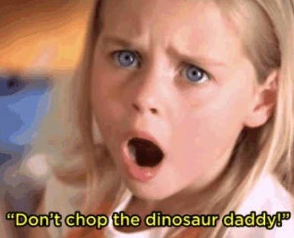 A young girl with her mouth open in shock; it is captioned &quot;Don&#x27;t chop the dinosaur daddy!&quot;