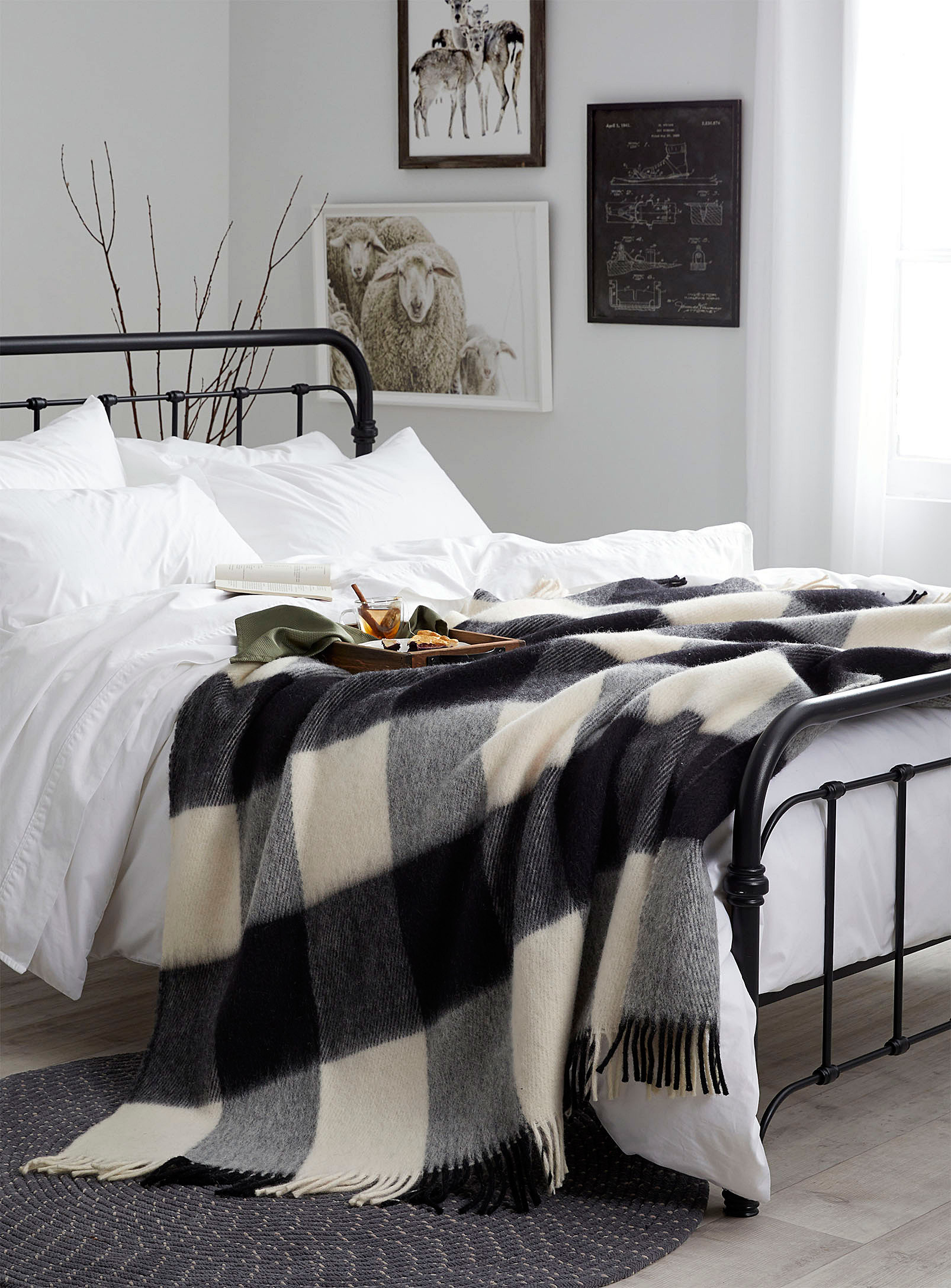 A throw blanket draped across a bed