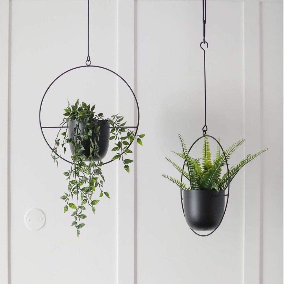 Two black planters hanging from ceiling