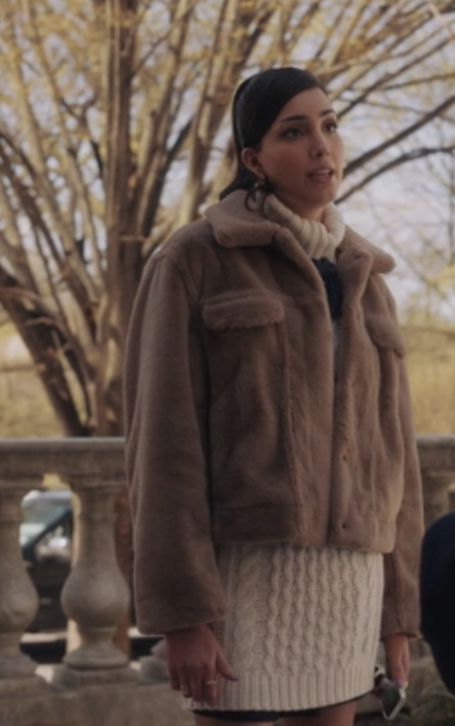 Luna wears a knee length knit turtleneck sweater dress under a fuzzy jacket
