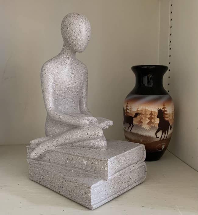 Reviewer's sculpture sitting on shelf