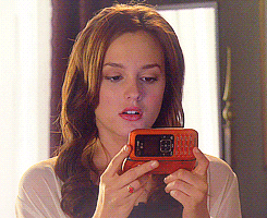 Blair Waldorf sighs and rolls her eyes before angrily closing her flip phone