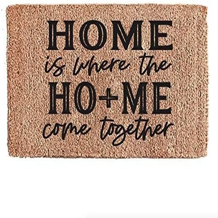 The doormat that reads "Home is where the Ho + Me come together"