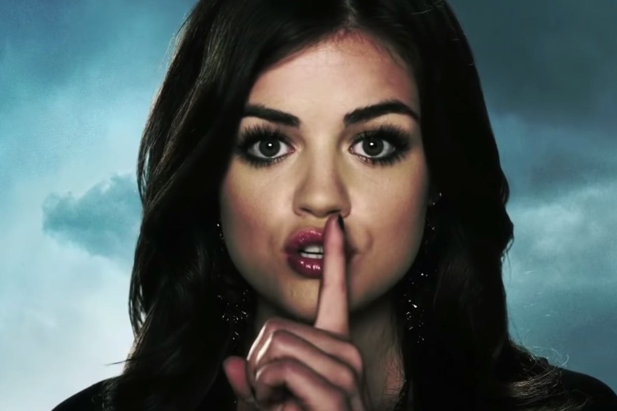 Aria from &quot;Pretty Little Liars&quot; making putting a finger to her lip in a &quot;shush&quot; motion in the opening credits