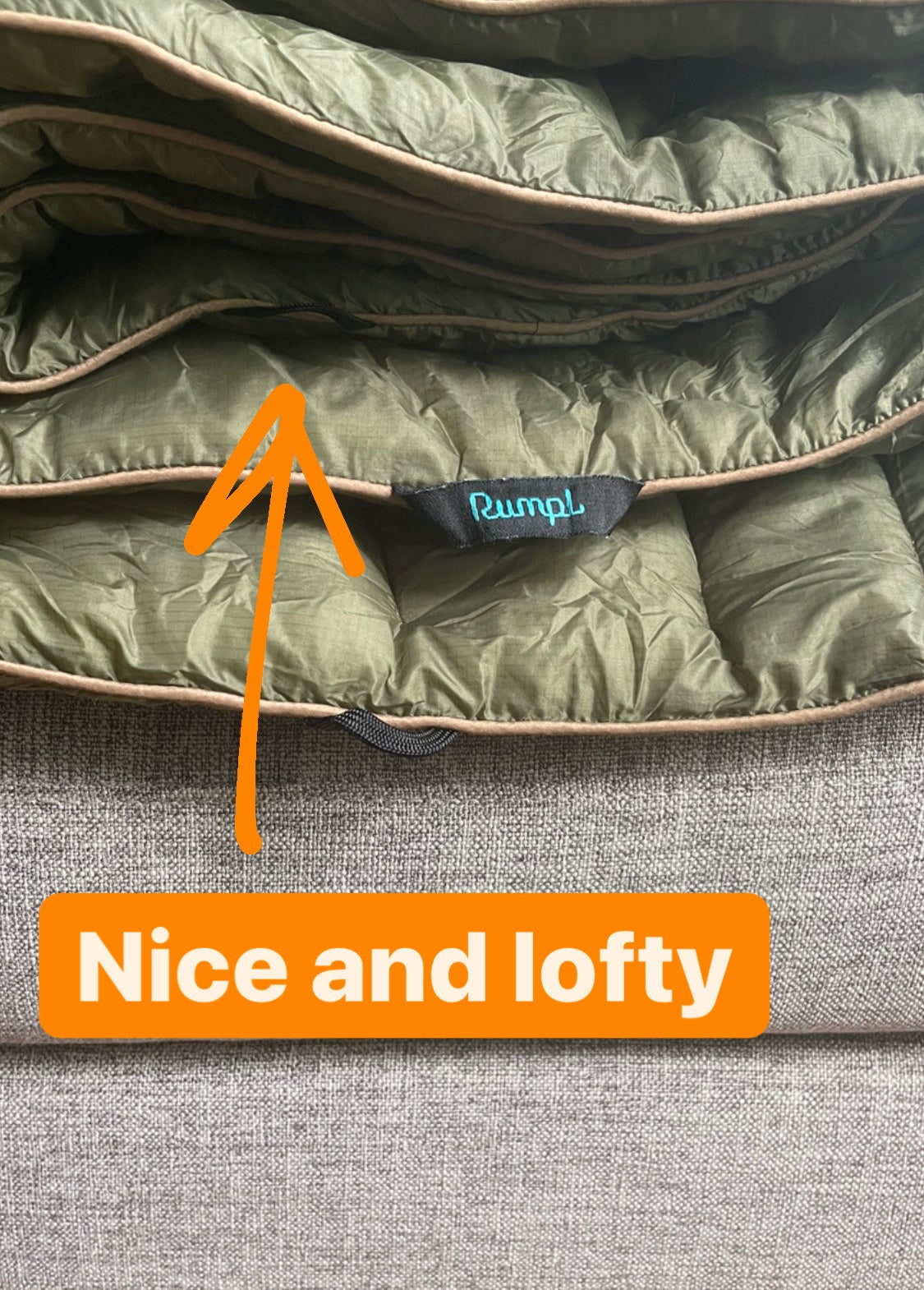 the writer&#x27;s puffy blanket folded and captioned &quot;nice and lofty&quot;