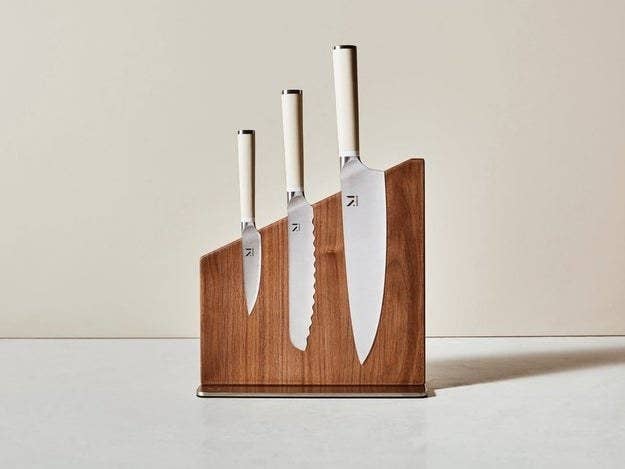 three knives stored upright in a wooden block