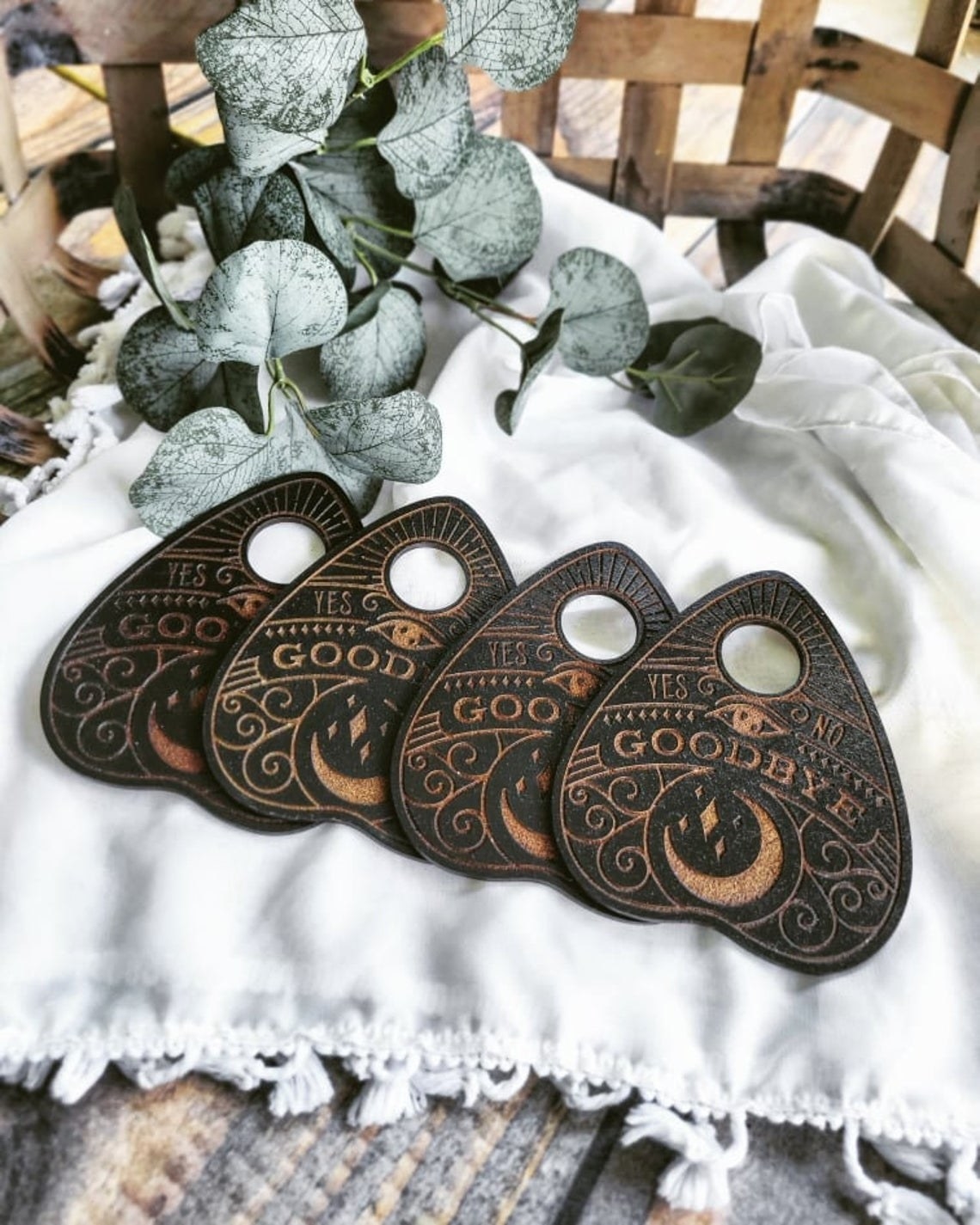 planchette coasters that say goodbye with a moon on the bottom