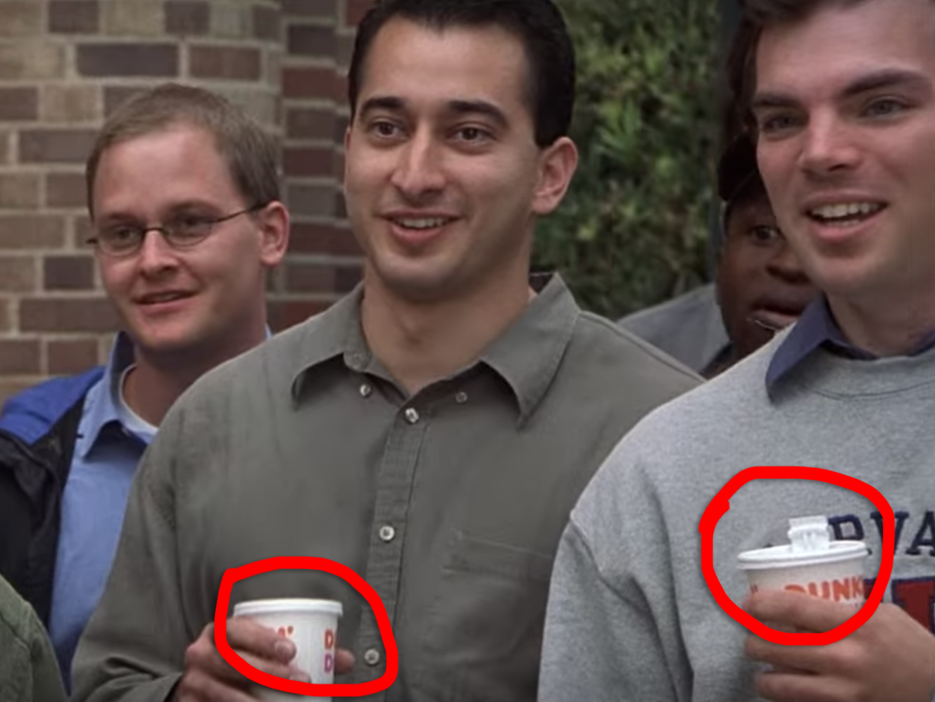 Some Harvard boys drinking cups of coffee from Dunkin&#x27;