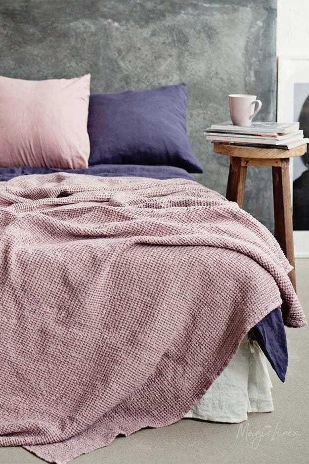 dusty pink linen blanket on a bed