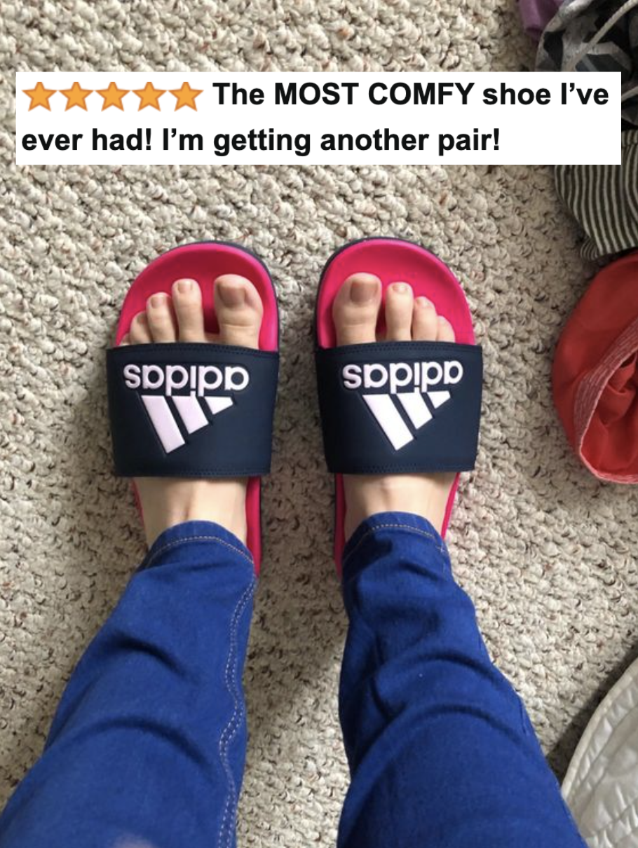 the Adidas slides on a reviewer&#x27;s feet with five-star caption &quot;The MOST COMFY shoe I’ve ever had! I’m getting another pair!&quot;