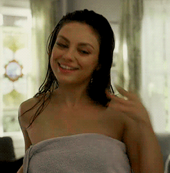 Mila Kunis drying off after a shower