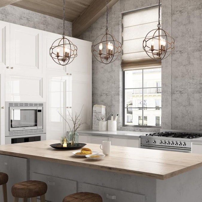 lifestyle image of rustic kitchen with three of the bronze chandeliers hanging