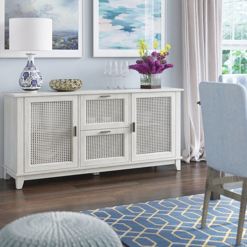 The chest in white in a dining room