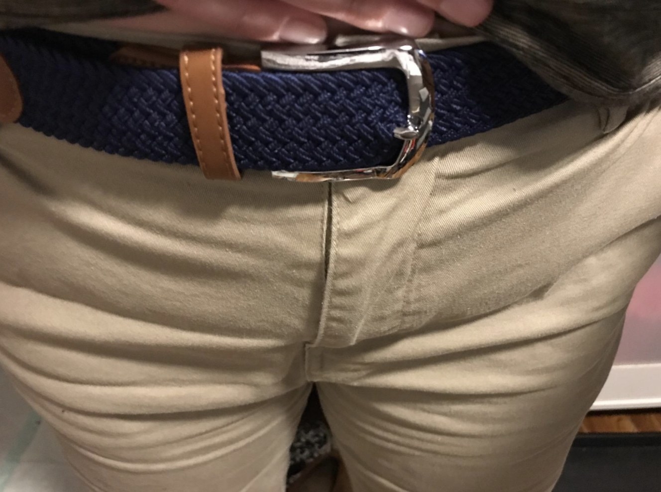 reviewer wearing the braided canvas belt in blue