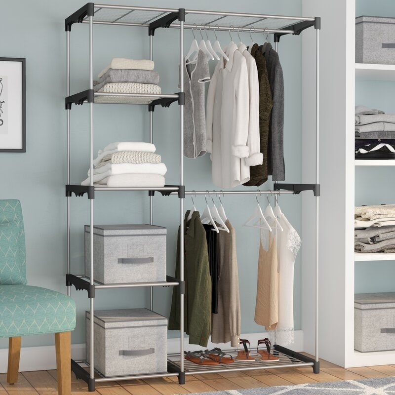 The closet system with an assortment of items on it.