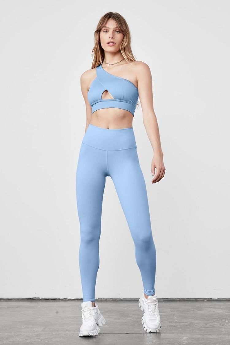 model wearing the light blue sports bra and leggings set