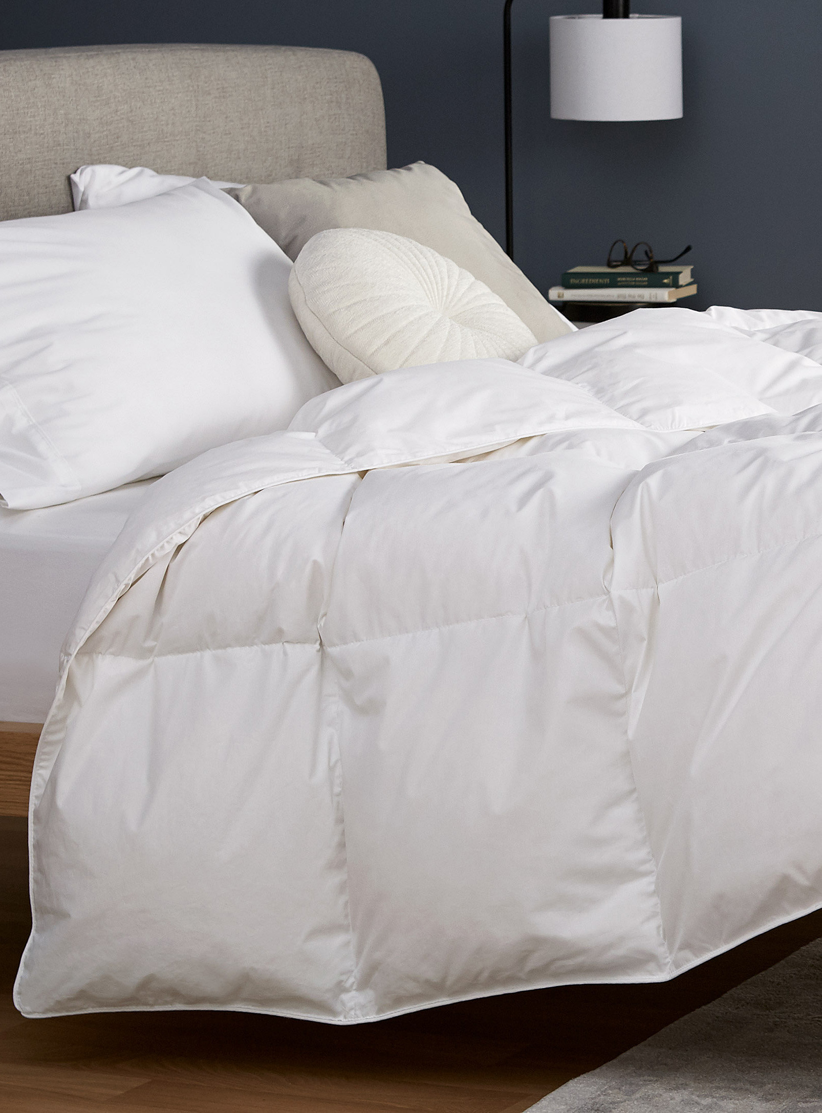 A duvet on a bed with pillows