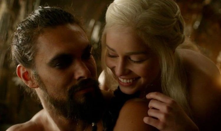 Jason as Drogo looks at Emilia as Khaleesi, who is behind him smiling