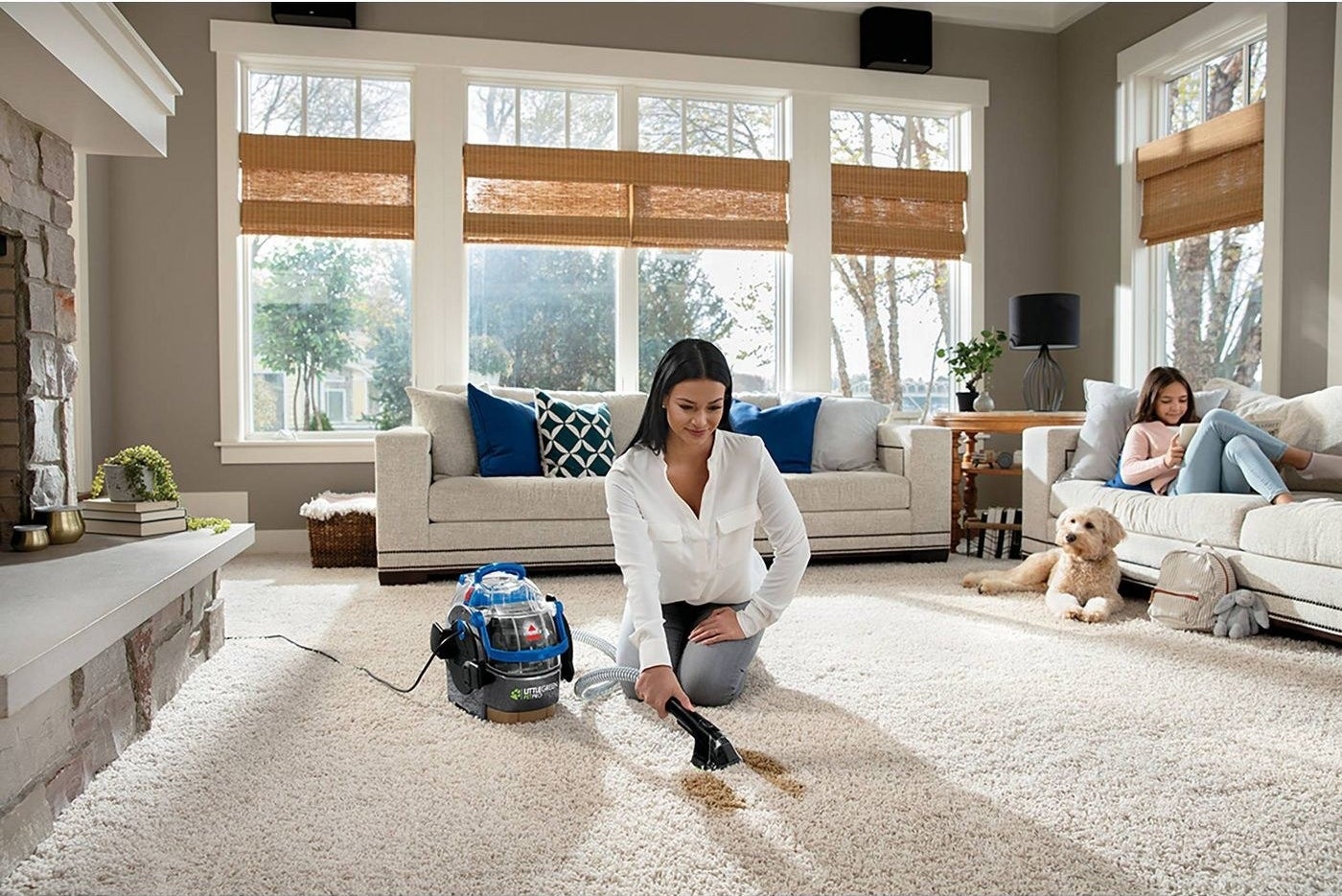 model using the machine to clean a brown stain on a cream carpet and you can clearly see where they've cleaned because the carpet is totally spotless