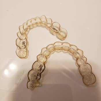Reviewer's Invisalign, which look slightly yellow
