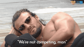 Gif of someone on Love Island AU saying, &quot;we&#x27;re not competing, man&quot;