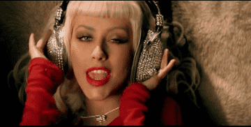 Christina Aguilera sings with bedazzled headphones on