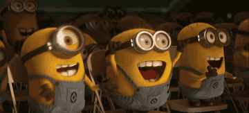 A GIF of minions clapping and cheering excitedly