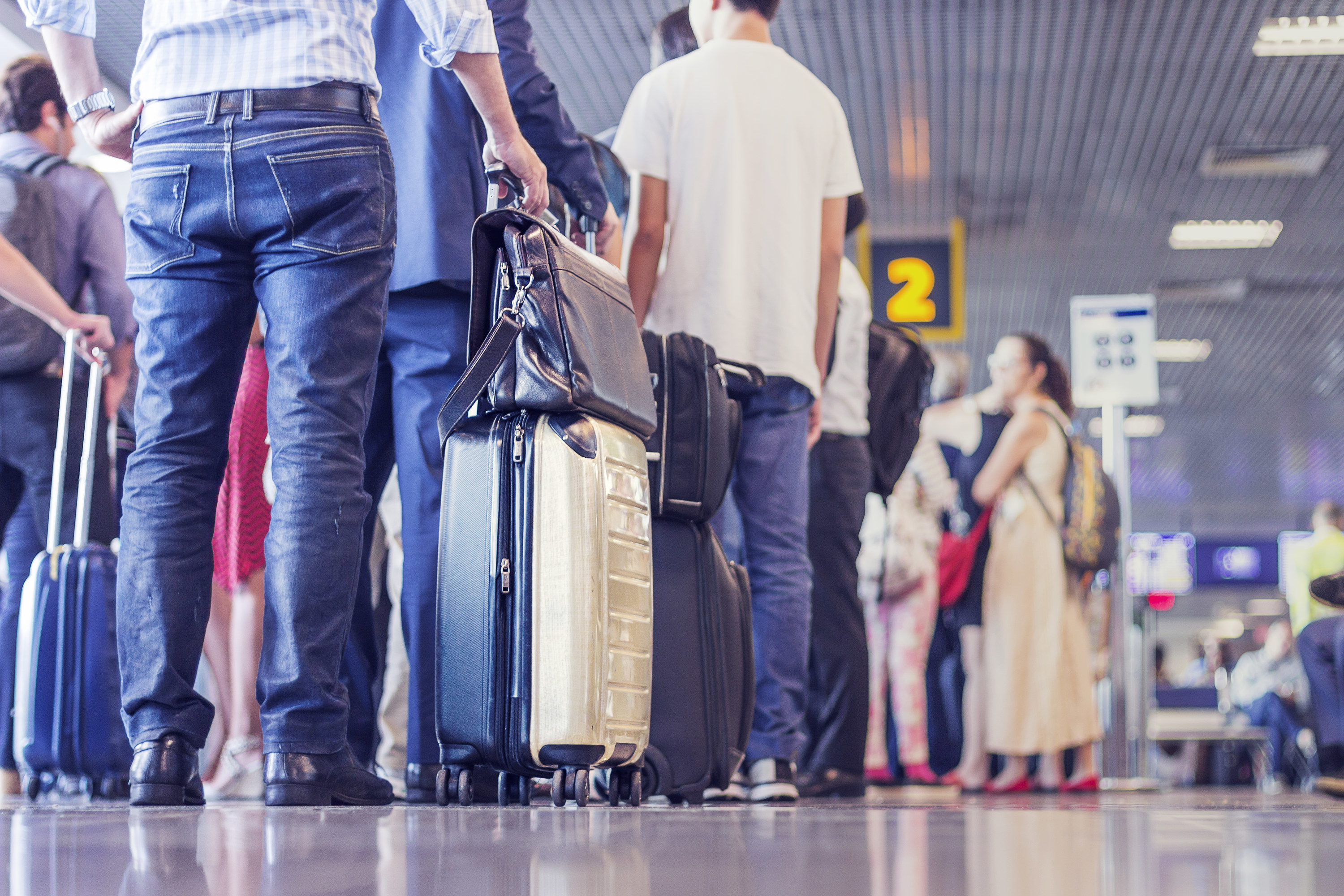 People waiting in line to board the plane