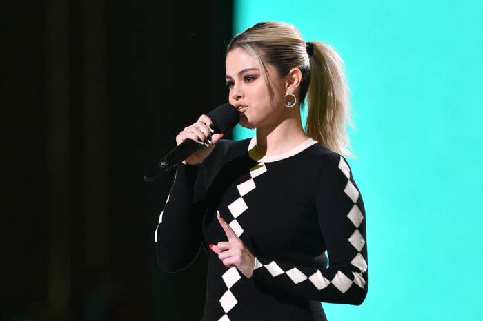 Selena Gomez speaks into a microphone onstage at the taping of Vax Live: The Concert to Reunite the World" in May 2021