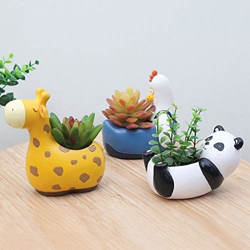 Three small planters in shapes of a hen, giraffe and panda with succulents inside them