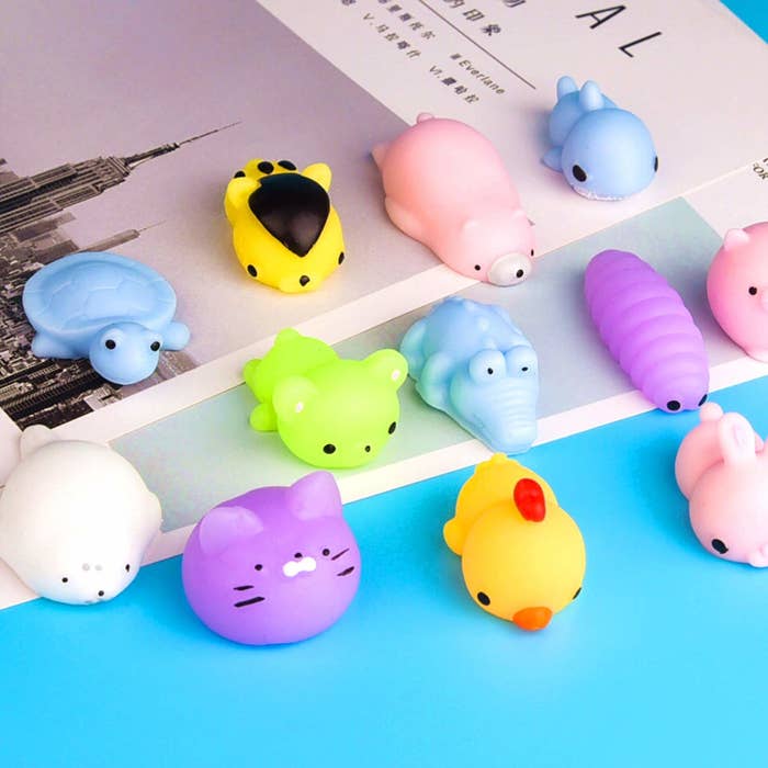 Small squishy toys in animal shapes kept on books