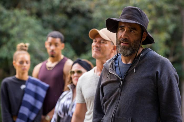 Samara Weaving, Melvin Gregg, Melissa McCarthy, Luke Evans, and Bobby Cannavale stand together in the woods