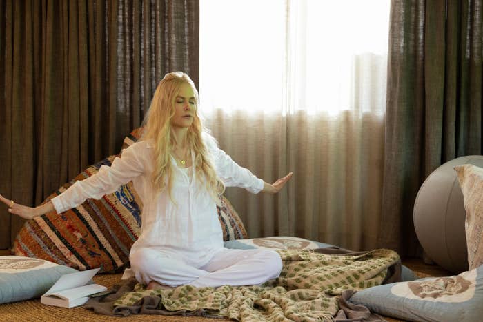 Nicole Kidman meditating on the floor