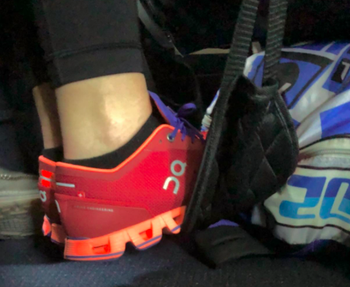 A customer review photo of them using the footrest on an airplane