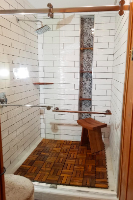 Reviewer's shower with the tiles on the bottom 
